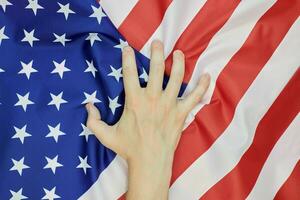 Hand crumpled national USA american flag photo