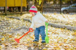 beautiful child playing on the playground photo