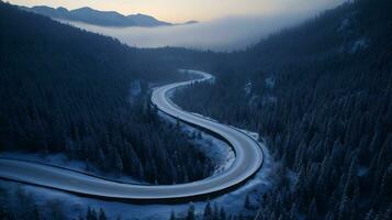 AI generated Curvy road by day from above, in the middle of a snow covered forest photo