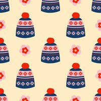 Blue winter hats with flowers seamless pattern. Cozy winter accessories. Headgear. Retro vintage colors. Background, wrapping paper. vector