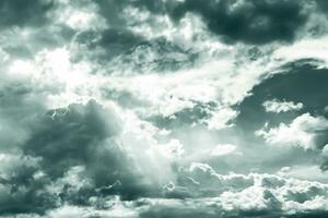 Gray and white fluffy clouds. Cloudy sky. White and gray texture background for sad, death, hopeless, and despair concept. Moody sky. Cloudscape. Dark dramatic sky. Background for dead and gloomy. photo