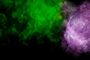 Green cloud of smoke on black background photo