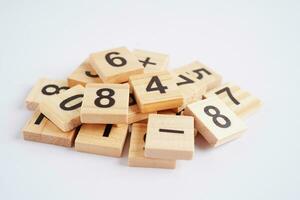 Number wood block cubes for learning Mathematic, education math concept. photo