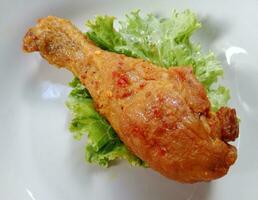 fresh fried chicken. fast food sign and symbol. photo