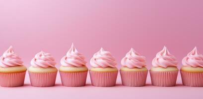 ai generado magdalenas con rosado Crema son en un fila en un rosado antecedentes foto