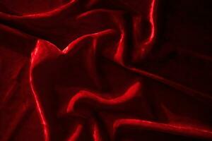 Abstract background made of red velvet fabric. photo
