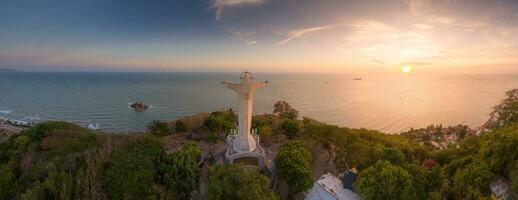 Aerial view of Vung Tau city, Vietnam, panoramic view of the peaceful and beautiful coastal city behind the statue of Christ the King standing on Mount Nho in Vung Tau city. photo