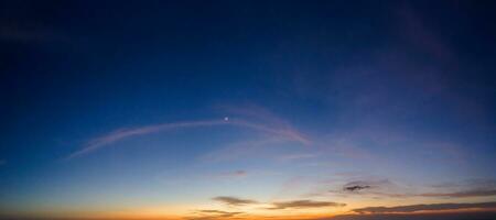 Horizon panorama and dramatic twilight sky and cloud sunset background. Natural sky background texture, beautiful color. photo