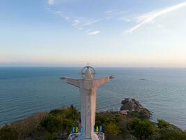 Aerial view of Vung Tau city, Vietnam, panoramic view of the peaceful and beautiful coastal city behind the statue of Christ the King standing on Mount Nho in Vung Tau city. photo