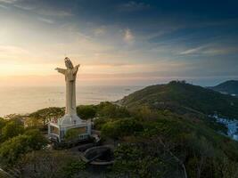 Aerial view of Vung Tau city, Vietnam, panoramic view of the peaceful and beautiful coastal city behind the statue of Christ the King standing on Mount Nho in Vung Tau city. photo