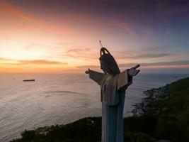 Aerial view of Vung Tau city, Vietnam, panoramic view of the peaceful and beautiful coastal city behind the statue of Christ the King standing on Mount Nho in Vung Tau city. photo