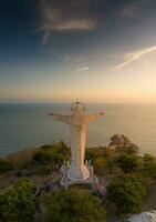 Aerial view of Vung Tau city, Vietnam, panoramic view of the peaceful and beautiful coastal city behind the statue of Christ the King standing on Mount Nho in Vung Tau city. photo