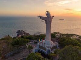 Aerial view of Vung Tau city, Vietnam, panoramic view of the peaceful and beautiful coastal city behind the statue of Christ the King standing on Mount Nho in Vung Tau city. photo