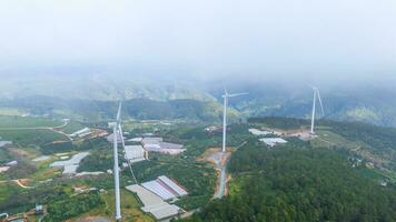 Beautiful landscape in the morning at Cau Dat, Da Lat city, Lam Dong province. Wind power on tea hill, morning scenery on the hillside of tea planted photo