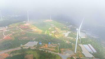 Beautiful landscape in the morning at Cau Dat, Da Lat city, Lam Dong province. Wind power on tea hill, morning scenery on the hillside of tea planted photo