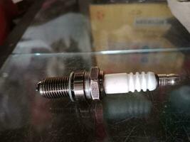 motorcycle spark plug. transportation element for turn on the machine photo