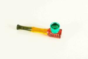 a glass pipe with a red and green tip photo
