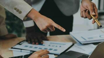 Co working conference, Business team meeting present, investor colleagues discussing new plan financial graph data on office table with laptop and digital tablet, Finance, accounting, investment. video