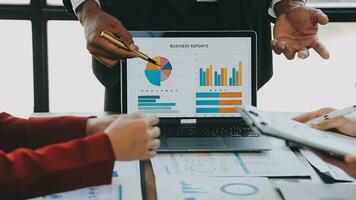 Co working conference, Business team meeting present, investor colleagues discussing new plan financial graph data on office table with laptop and digital tablet, Finance, accounting, investment. video