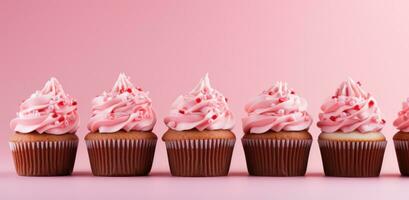 AI generated cupcakes with pink frosting are in a row on a pink background photo