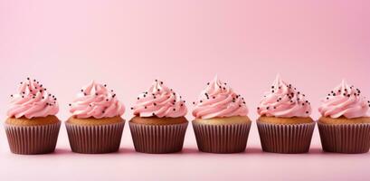 AI generated cupcakes with pink frosting are in a row on a pink background photo