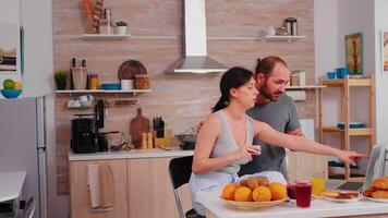 Couple doing online shopping on laptop during breakfast. Entering information, customer using e-commerce technology buying stuff on the web, cosumerism banking and ordering photo