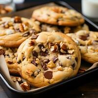 AI generated tray of freshly baked cookies, with chocolate chips and chunks of nuts peeking out from the dough. photo