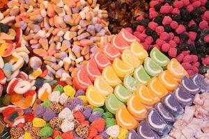 display of a bunch of colorful chewy jellies with various shape and taste photo