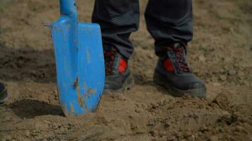 AI generated Shovel in the hands of a man on a construction site photo