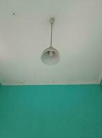 a lamp hanging on the ceiling photo