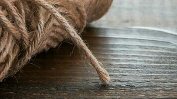 Macro from rope on rustic wooden table  with copy space photo