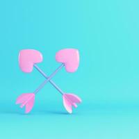 Pink two crossed cupid arrows on bright blue background in pastel colors photo