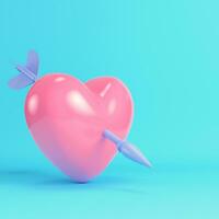 Pink heart pierced by cupid arrow on bright blue background in pastel colors photo