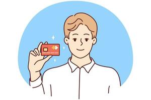 Smiling young man show plastic bank debit or credit card. Happy male client or customer posing with new card issued. Vector illustration.