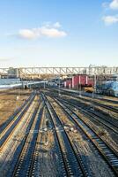 above view empty railroad tracks at railway siding photo