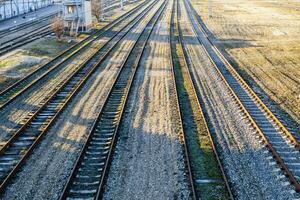 above view empty railway tracks on sunny day photo