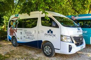 Coba Quintana Roo Mexico 2023 Parking lot parked tourist busses vans cars Coba Ruins Mexico. photo