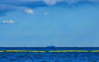 Boats yachts ship catamaran jetty beach Playa del Carmen Mexico. photo