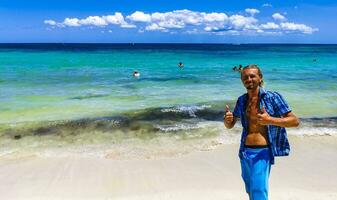 Male tourist Travelling man posing model Playa del Carmen Mexico. photo