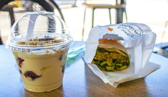 Voula Attica Greece 2018 Greek Greek yogurt and veggie vegan vegetarian wrap to go Greece. photo