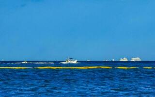 Boats yachts ship catamaran jetty beach Playa del Carmen Mexico. photo