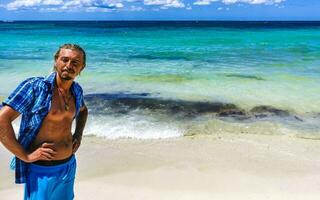 Male tourist Travelling man posing model Playa del Carmen Mexico. photo