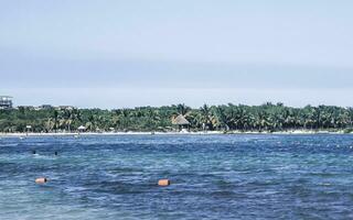 Tropical Caribbean beach clear turquoise water Playa del Carmen Mexico. photo