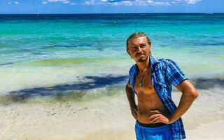 Male tourist Travelling man posing model Playa del Carmen Mexico. photo