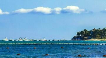 Boats yachts catamaran jetty ships port Playa del Carmen Mexico. photo