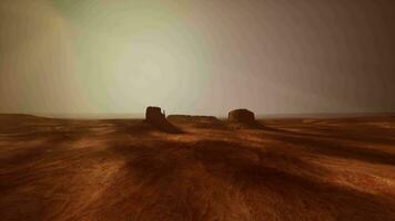 Two rocks in the desert captured from an aerial perspective video