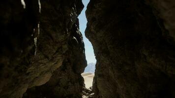 A narrow passage between two large rocks video