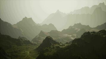 A majestic mountain range shrouded in an ethereal fog video