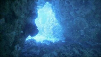 A cave with a blue light coming out of it video