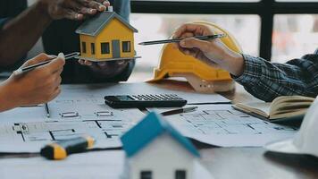 Hands of architect or engineer working on blueprint meeting for project working with partner on model building and engineering tools in working site, Construction and structure concept. video